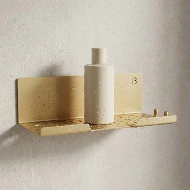 Étagère de douche murale acier inoxydable or aube avec flacon — BIOM Paris